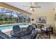 Screened lanai featuring a ceiling fan and overlooks a private backyard at 6250 Silver Leaf Ln, Lakeland, FL 33813