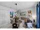 Stylish home office with a round table, eclectic art, and ample light at 6250 Silver Leaf Ln, Lakeland, FL 33813