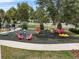 A fun playground with colorful equipment, chairs, and play areas for to have fun at 6250 Silver Leaf Ln, Lakeland, FL 33813