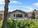 A backyard view of a sparkling screened-in pool with a seating area and lush foliage at 6250 Silver Leaf Ln, Lakeland, FL 33813