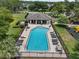 A beautiful community pool with plenty of chairs and tables to enjoy the sunshine at 6250 Silver Leaf Ln, Lakeland, FL 33813
