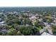 Aerial view of a neighborhood with mature trees and well-maintained homes, creating a peaceful residential area at 645 E Church St, Bartow, FL 33830