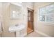 Bathroom with pedestal sink and glass enclosed shower at 645 E Church St, Bartow, FL 33830