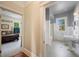 Bathroom with tub and view to bedroom at 645 E Church St, Bartow, FL 33830