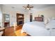 Bedroom featuring hardwood floors, fireplace, and vintage furnishings at 645 E Church St, Bartow, FL 33830