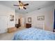 Bedroom featuring light carpet, a ceiling fan, and a crib at 645 E Church St, Bartow, FL 33830
