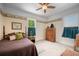 Bedroom with a decorative border, a ceiling fan, and two windows at 645 E Church St, Bartow, FL 33830