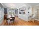 Charming dining area with blue accent wall, hardwood floors, and views of the outdoors at 645 E Church St, Bartow, FL 33830