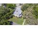 Aerial view of a beautiful two-story home with a lush green lawn and mature trees at 645 E Church St, Bartow, FL 33830