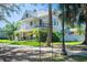 Beautiful historical home, showcasing lush landscaping and a charming porch at 645 E Church St, Bartow, FL 33830