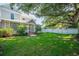 Charming home with well-maintained front yard, mature trees, and inviting entrance at 645 E Church St, Bartow, FL 33830