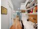 Hallway with hardwood floors, built-in desk, and view into the kitchen and dining areas at 645 E Church St, Bartow, FL 33830