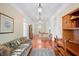 Spacious hallway with hardwood floors, vintage furniture, and decorative rug at 645 E Church St, Bartow, FL 33830