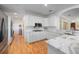 Bright kitchen features white cabinets, stainless steel appliances, and marble countertops at 645 E Church St, Bartow, FL 33830