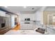 A modern kitchen with white cabinets, marble countertops, and stainless steel appliances offers a sleek design at 645 E Church St, Bartow, FL 33830
