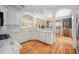 Modern kitchen with white cabinets, marble countertops, and stainless steel appliances for a sleek and stylish design at 645 E Church St, Bartow, FL 33830
