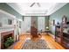 Stylish living room with fireplace, hardwood floors, natural light, and decorative accents at 645 E Church St, Bartow, FL 33830