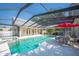 Enclosed pool area with patio furniture at 645 E Church St, Bartow, FL 33830