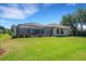 Lush backyard with a screened patio and sparkling pool at 6527 Eagle Ridge Way, Lakeland, FL 33813