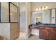 Bathroom featuring a glass enclosed shower and granite countertops at 6527 Eagle Ridge Way, Lakeland, FL 33813