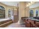 Spacious bathroom with soaking tub, glass shower, and dual vanity with granite counters at 6527 Eagle Ridge Way, Lakeland, FL 33813