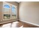 Bright bedroom featuring hardwood floors, neutral paint, and large windows letting in ample natural light at 6527 Eagle Ridge Way, Lakeland, FL 33813