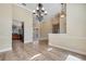 Open concept dining area featuring tile flooring, crown molding, and modern lighting at 6527 Eagle Ridge Way, Lakeland, FL 33813