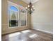 Bright dining room with tile floors, crown molding, and abundant natural light at 6527 Eagle Ridge Way, Lakeland, FL 33813