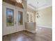 Elegant foyer featuring tile flooring, decorative lighting, and a clear view into other living spaces at 6527 Eagle Ridge Way, Lakeland, FL 33813