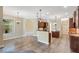 Open-concept kitchen featuring granite counters, pendant lighting, and stainless steel appliances at 6527 Eagle Ridge Way, Lakeland, FL 33813