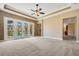 Spacious living room features backyard views with access via sliding glass doors at 6527 Eagle Ridge Way, Lakeland, FL 33813