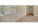 Bright living room featuring neutral carpet, and access to a patio through glass doors at 6527 Eagle Ridge Way, Lakeland, FL 33813