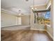 Spacious living room with tile and carpet flooring, ceiling fan, and large windows at 6527 Eagle Ridge Way, Lakeland, FL 33813