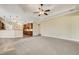 Open concept living room features tile and carpeted floors with kitchen access at 6527 Eagle Ridge Way, Lakeland, FL 33813