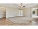 Spacious living room features tile and carpeted floors and a tray ceiling at 6527 Eagle Ridge Way, Lakeland, FL 33813