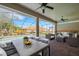 Screened patio with ample seating and dining area, overlooking a private pool and backyard at 6527 Eagle Ridge Way, Lakeland, FL 33813