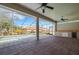 Open-air patio with ceiling fans and an outdoor kitchen with views of the pool and backyard at 6527 Eagle Ridge Way, Lakeland, FL 33813