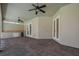 Spacious screened patio area with brick flooring and ceiling fans, perfect for entertaining at 6527 Eagle Ridge Way, Lakeland, FL 33813
