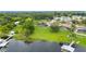 Picturesque waterfront property with lush landscaping and boat dock at 7016 Summit Cir, Winter Haven, FL 33884