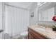 Bathroom featuring granite countertops, modern fixtures and tiled floors at 7016 Summit Cir, Winter Haven, FL 33884