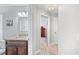 Bathroom with granite countertop and tile floors at 7016 Summit Cir, Winter Haven, FL 33884