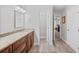 Bathroom featuring granite countertop and wood-look tile at 7016 Summit Cir, Winter Haven, FL 33884