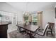 Formal dining room features a chandelier and big window views at 7016 Summit Cir, Winter Haven, FL 33884