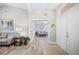 Spacious foyer with tile floors and views of the living room and sitting room at 7016 Summit Cir, Winter Haven, FL 33884