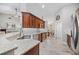 Modern kitchen with granite countertops, stainless steel appliances, and ample cabinet space at 7016 Summit Cir, Winter Haven, FL 33884