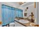 Bathroom featuring patterned shower curtain and a vanity with sink at 7311 Briarbay Loop, Lakeland, FL 33810