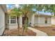 Charming home exterior featuring a well-maintained walkway at 7311 Briarbay Loop, Lakeland, FL 33810