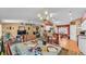 Open concept living area with chandelier, breakfast bar, and view of the kitchen at 7311 Briarbay Loop, Lakeland, FL 33810