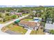Aerial view of the property showing a fenced backyard with pool and spacious surroundings at 808 Austin Cir, Bartow, FL 33830