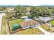 Aerial view showcasing the property's backyard, pool, storage shed, and spacious surroundings at 808 Austin Cir, Bartow, FL 33830